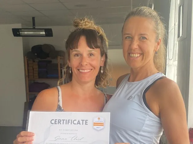 Raili Maripuu and Katia Major with a 200-hour Foundation Training graduate certificate at Thames Wellness Academy